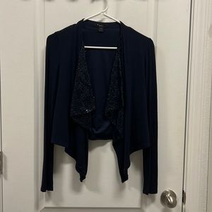 Trendy throw that dresses up any outfit.  Excellent condition.